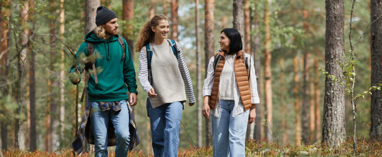 Young People Hiking in Forest